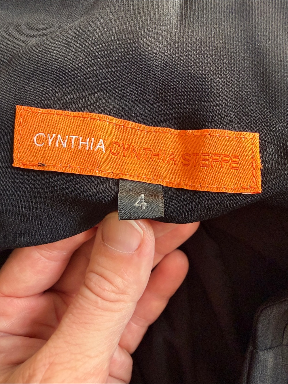 Cynthia Steffe black lined polyester black dress-sz 4. Side zip. Low,draped back